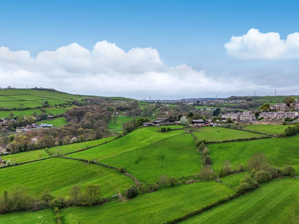 A rural landscape with fields and houses at Belvedere Farm in Hipperholme