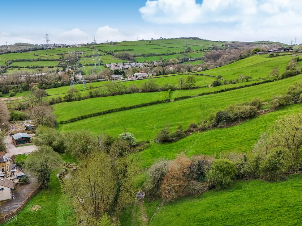 An aerial view of fields and trees at Belvedere Farm in Hipperholme