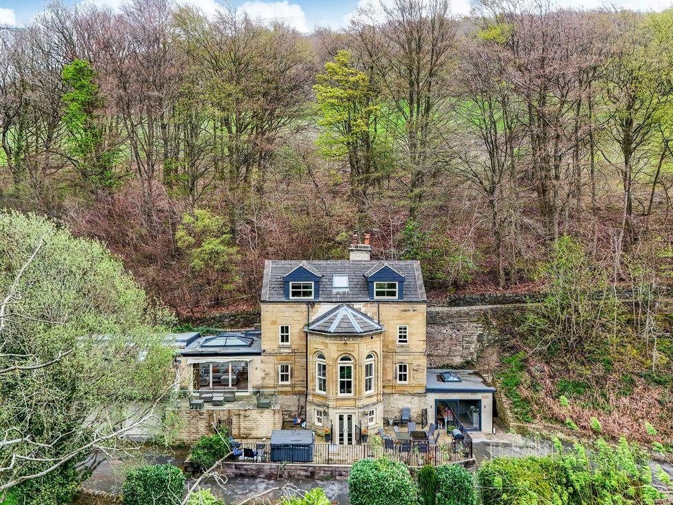 A house surrounded by trees at Belvedere Farm in Hipperholme