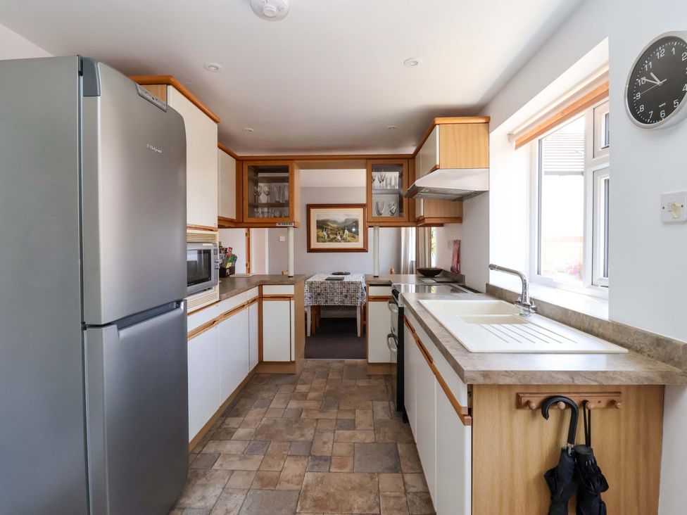 A kitchen with refrigerator and sink at 3 Springhaven Hampsthwaite
