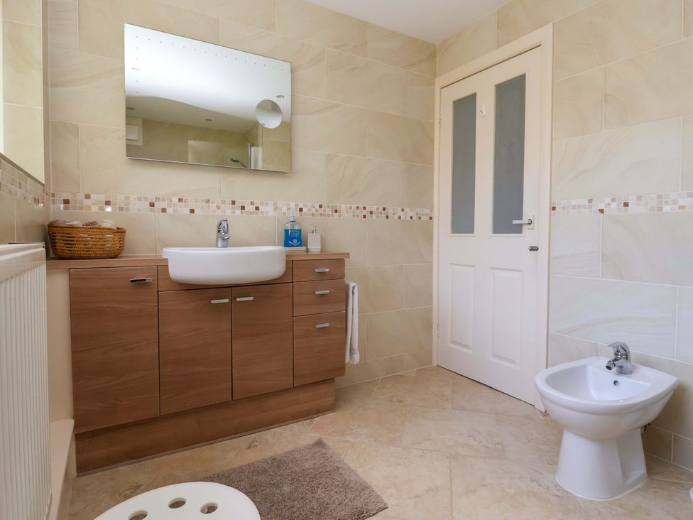 A bathroom with a sink and bidet at 3 Springhaven in Hampsthwaite