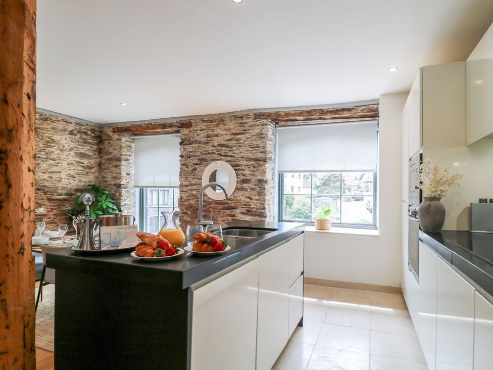 A kitchen with a countertop and window at 9 The Pottery in Dartmouth