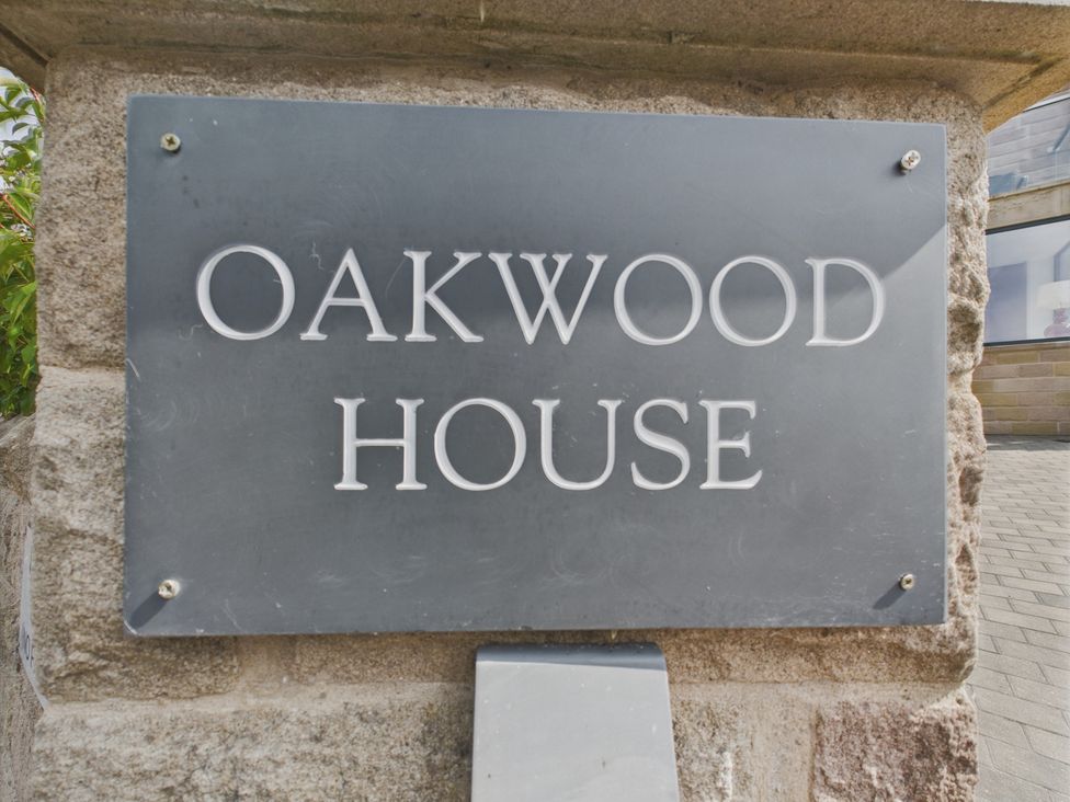 A nameplate displaying Oakwood House at Oakwood House in Tansley near Matlock