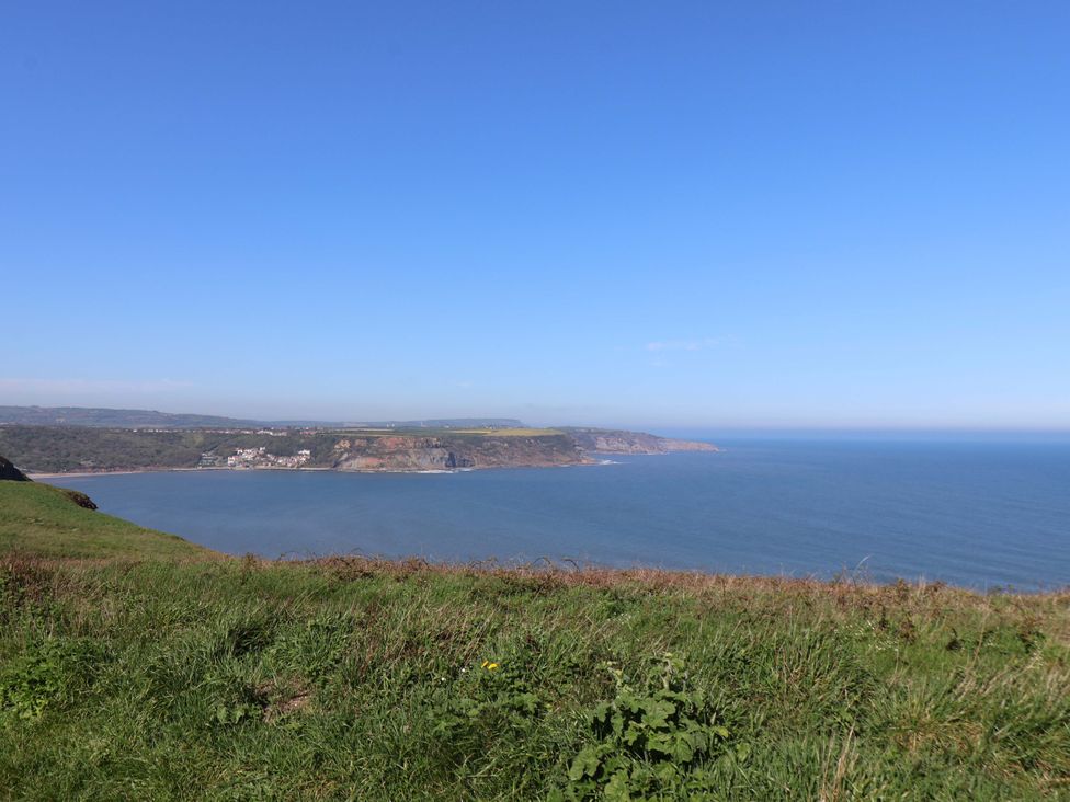A coastal view with grass and sea at Voebroch in Lythe