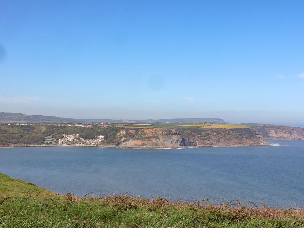 A coastal view with cliffs and a village at Voebroch in Lythe