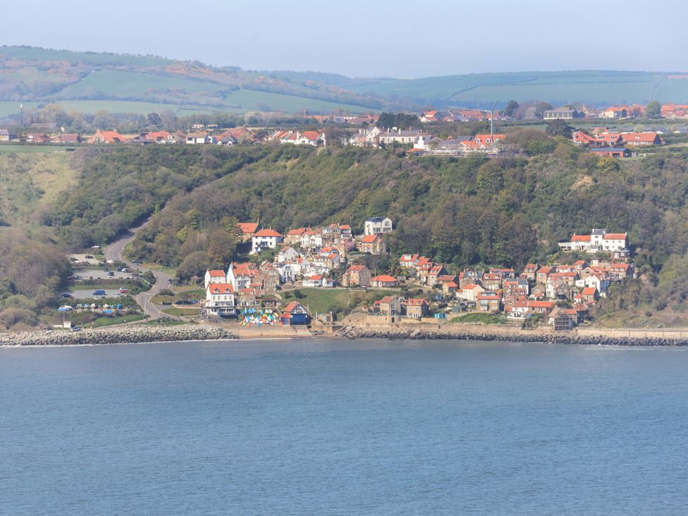 A coastal view with houses and hills at Voebroch in Lythe