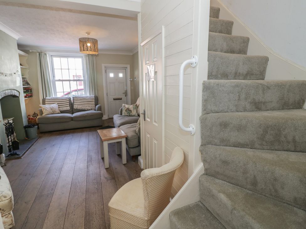 A living room with a sofa and coffee table at Heath Cottage Stratford-Upon-Avon