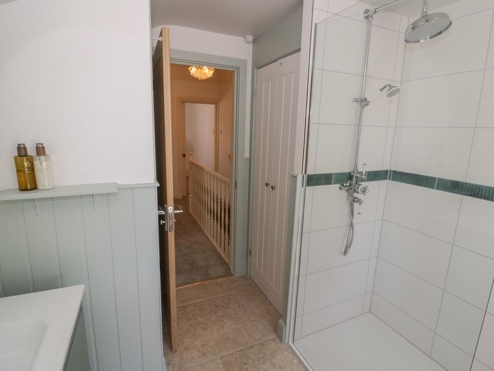 A bathroom with a shower and sink at Heath Cottage Stratford-Upon-Avon