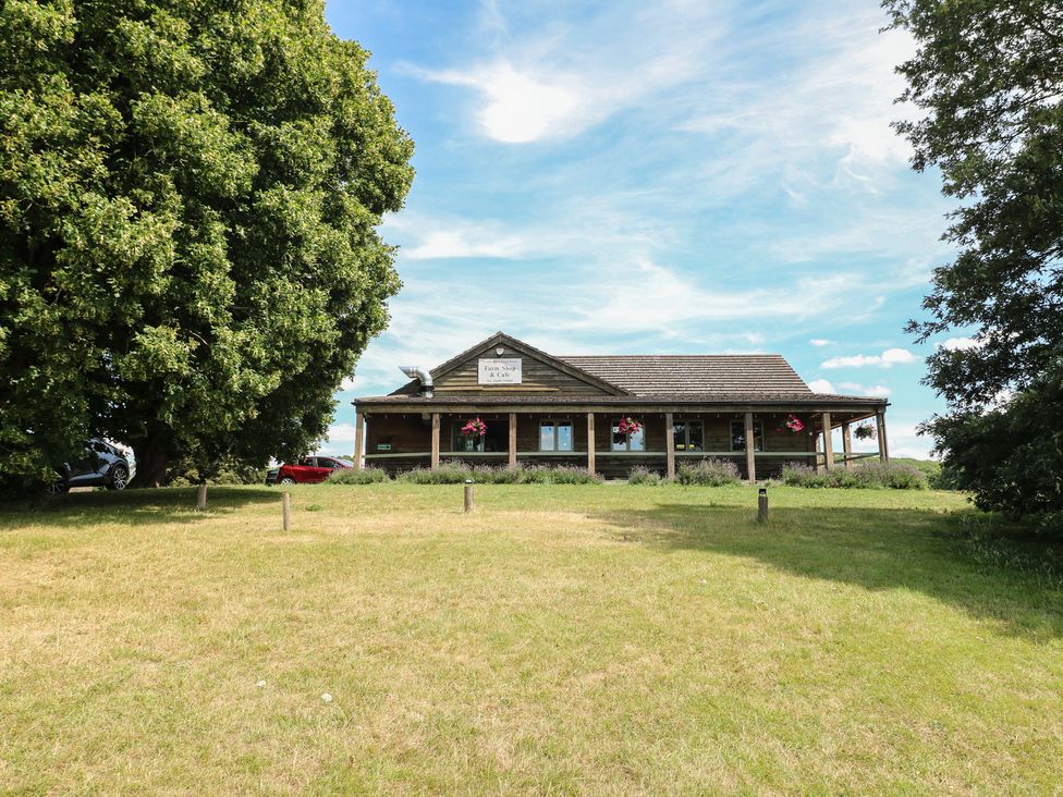 A building with a sign and trees at Sunny Cottage in Grantham