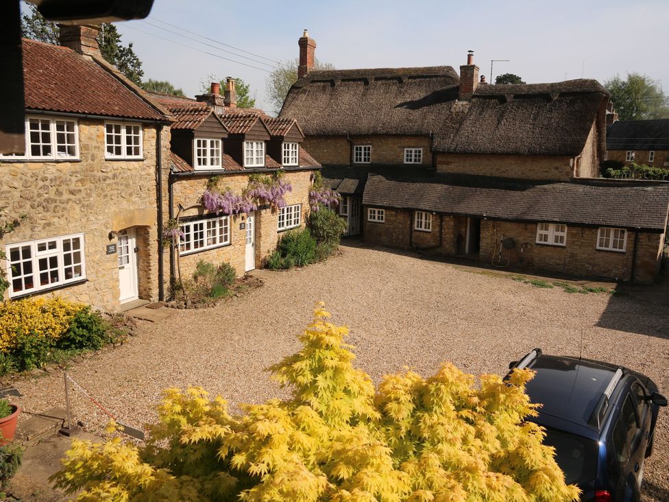 A view of cottages and a gravel driveway at The Old Bakery South Perrott near Mosterton