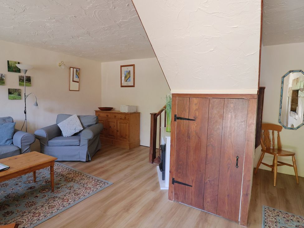 A living room with a sofa and coffee table at The Old Bakery in South Perrott near Mosterton