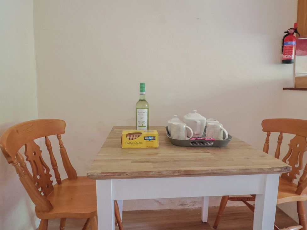 A dining room with a table set for tea at The Old Bakery South Perrott near Mosterton