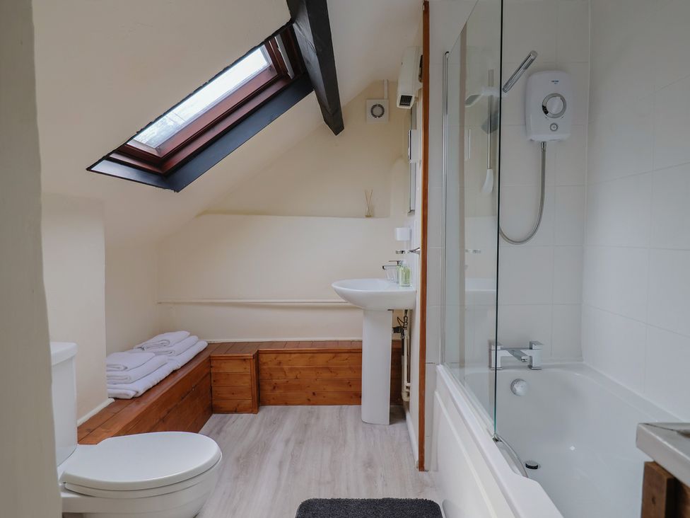 A bathroom with a shower and bath at The Old Bakery in South Perrott near Mosterton
