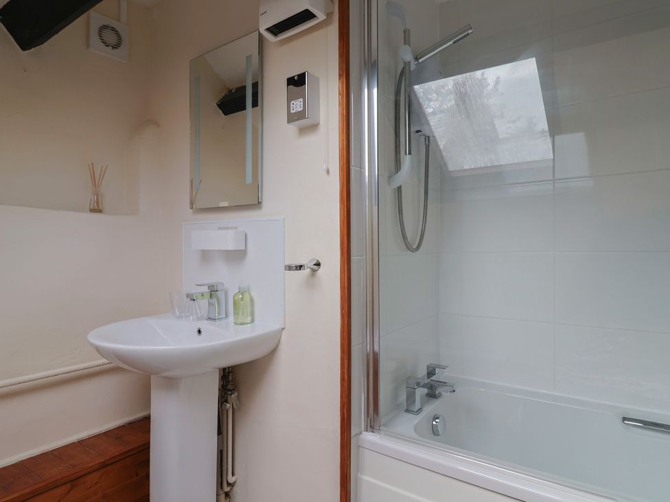 A bathroom with a sink and shower at The Old Bakery South Perrott near Mosterton