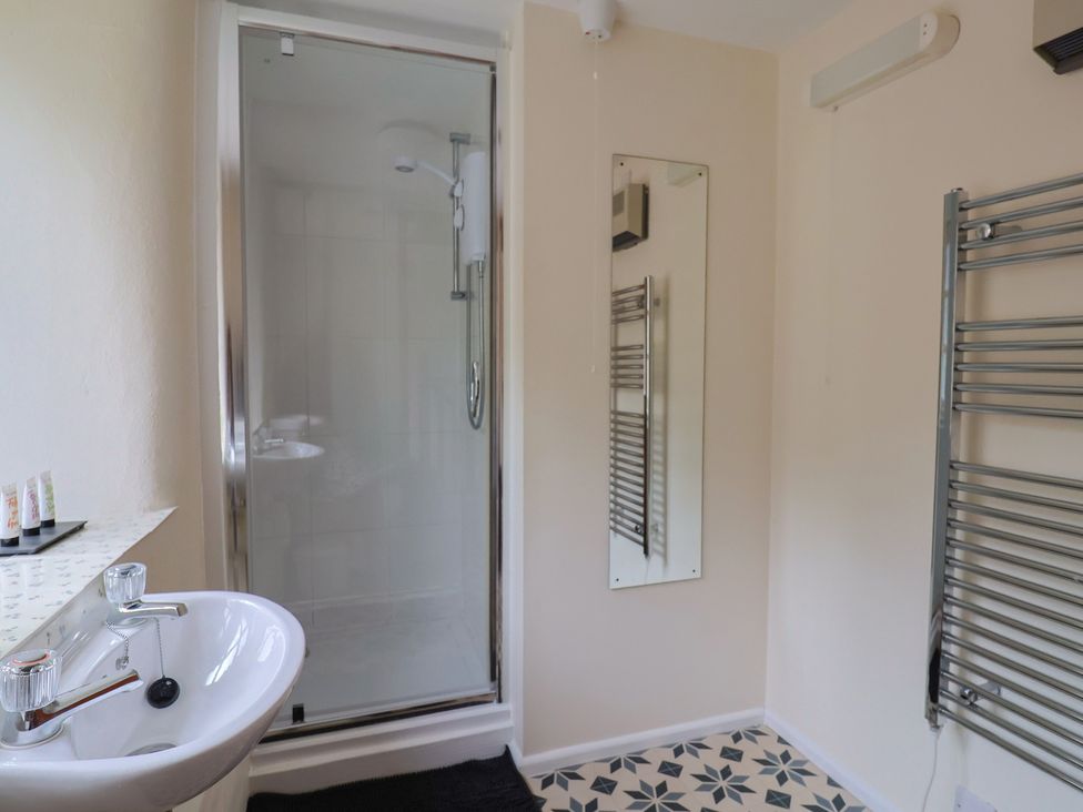 A bathroom with a shower and sink at Jasmine Cottage South Perrott near Mosterton