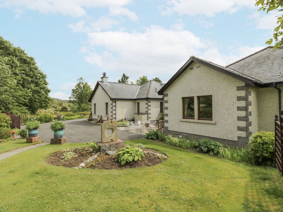 A house with a garden and pathway at Torview House Lyne Station near Peebles