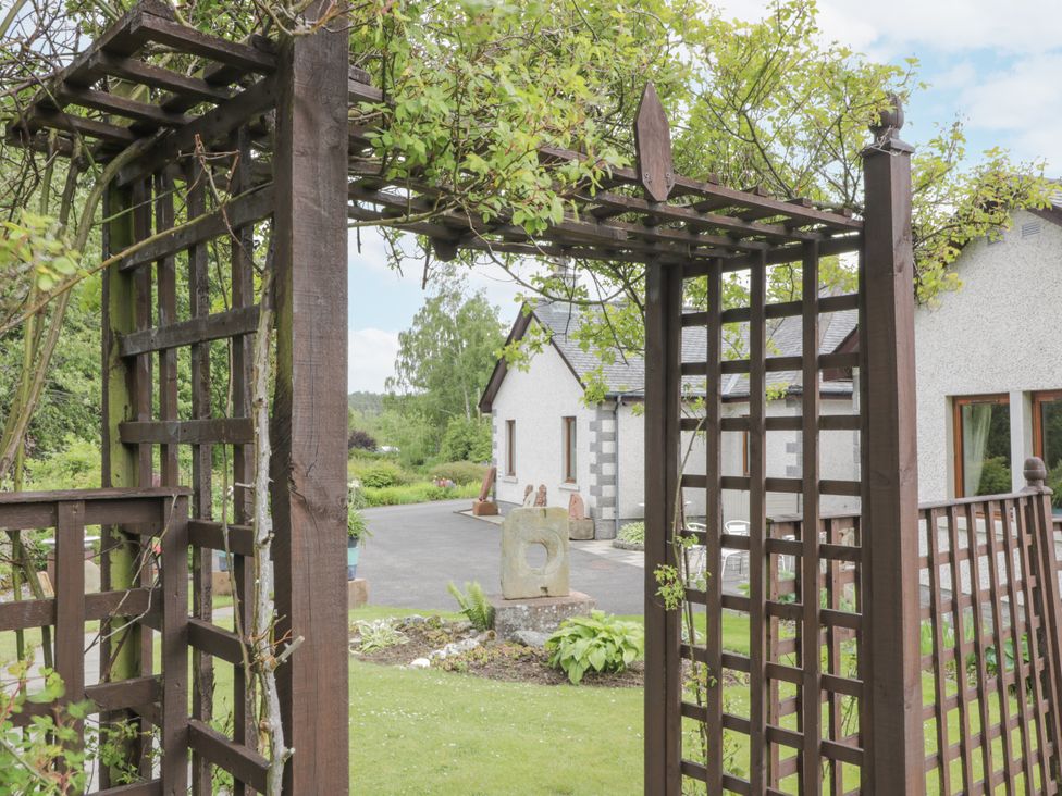 A trellis archway leading to a garden at Torview House Lyne Station near Peebles
