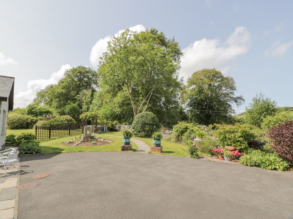 A garden with a path and flowers in front of a house at Torview House Lyne Station near Peebles