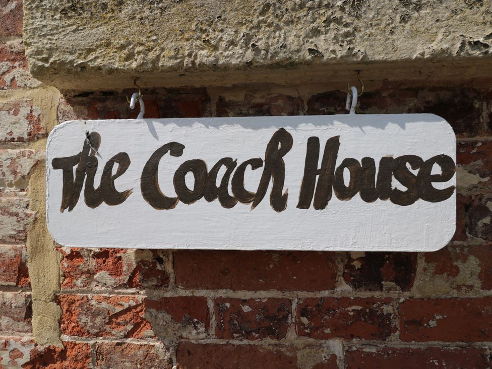 A sign reading The Coach House at Coach House Swindon