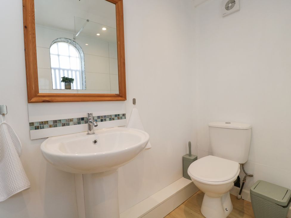 A bathroom with a sink and toilet at Coach House in Swindon