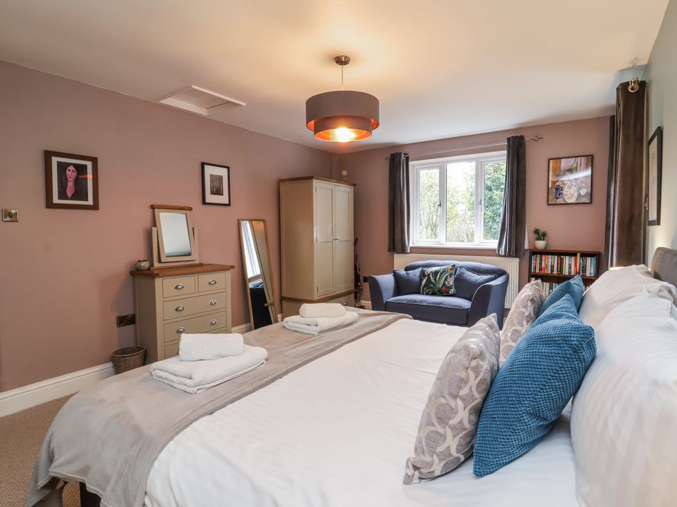 A bedroom with a bed and wardrobe at Ferndale in Lynton