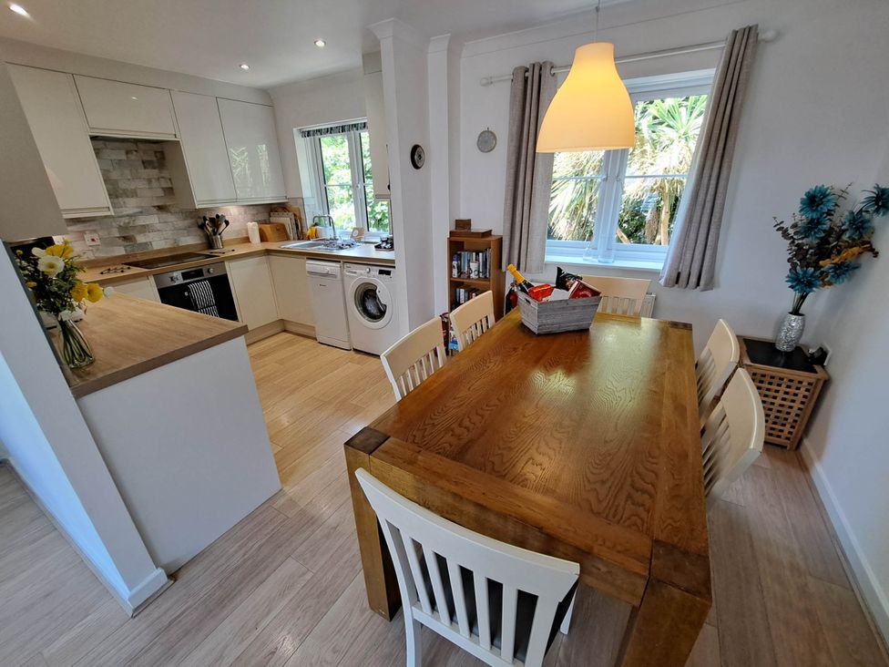 A kitchen with dining area at Castle Cove View in Castle Cove
