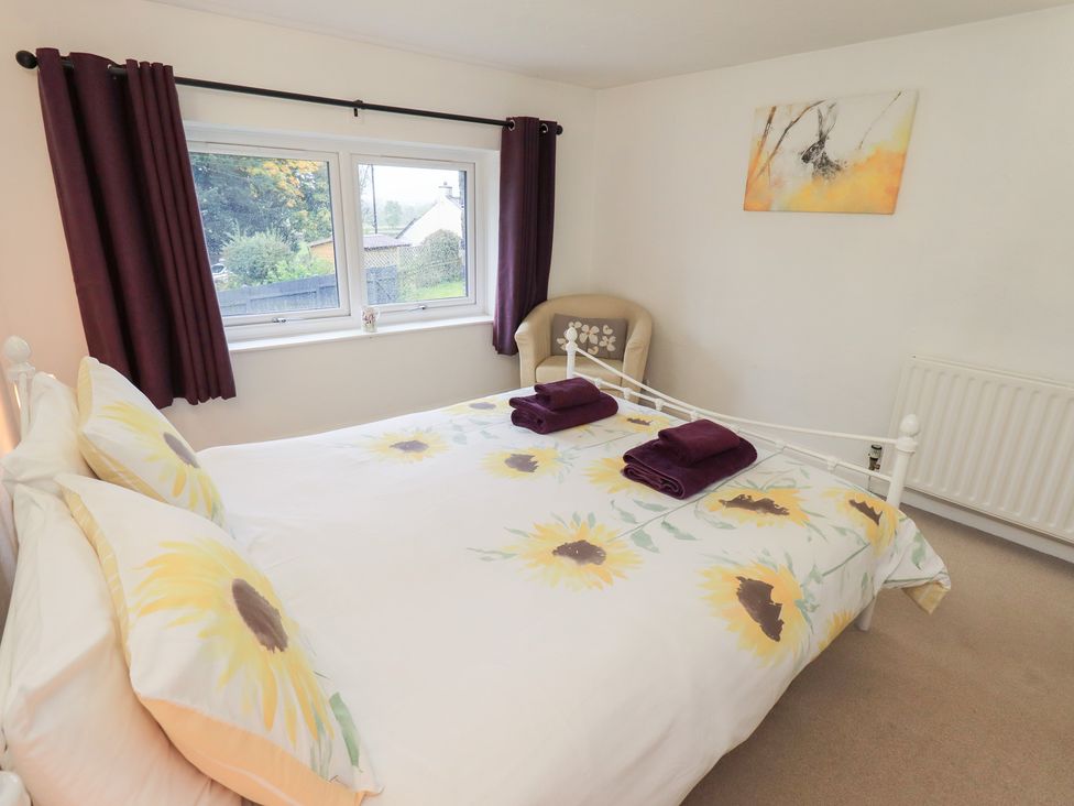 A bedroom with a bed and window at Kiln How Threlkeld