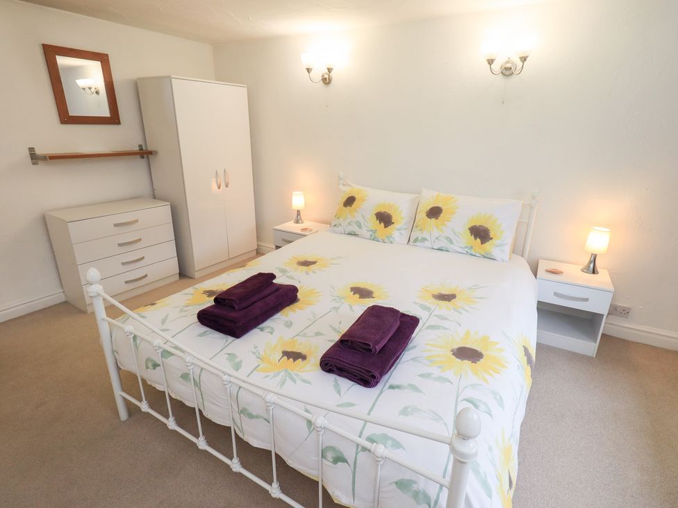 A bedroom with a bed and furniture at Kiln How Threlkeld