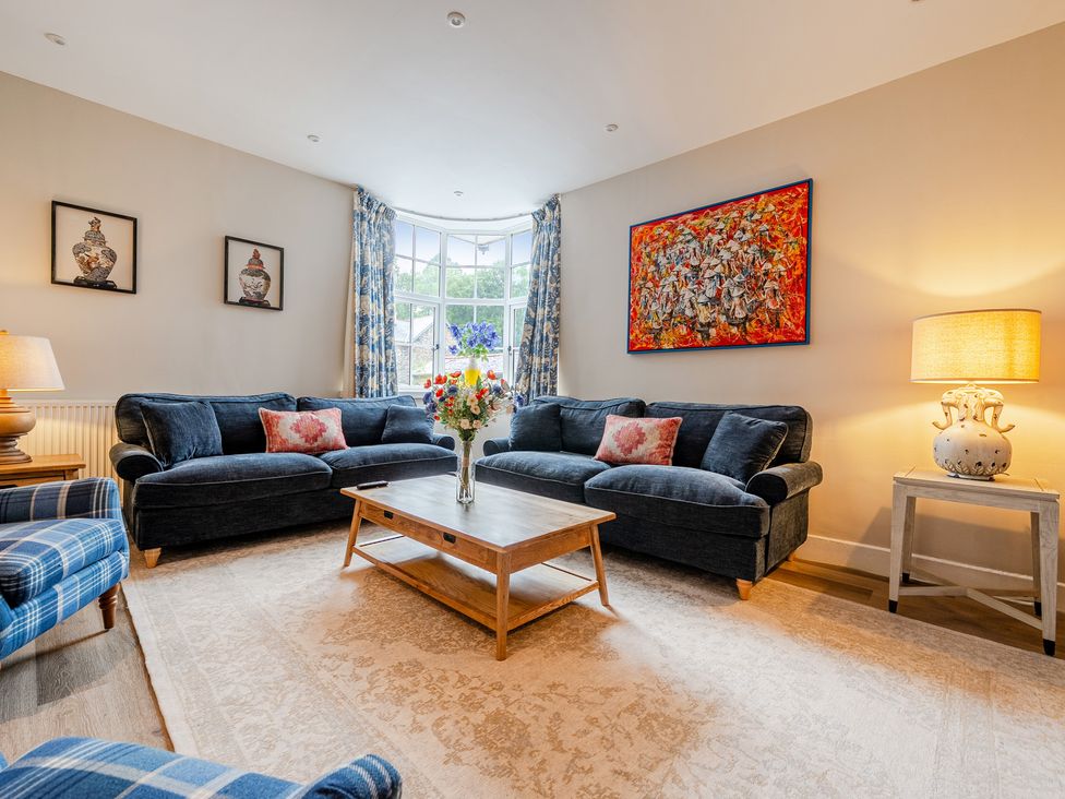 A living room with sofas and a coffee table at Home Farmhouse at the Graythwaite Estate near Hawkshead