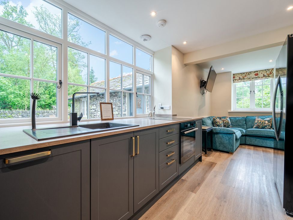 A kitchen with a sink and countertop at Home Farmhouse at the Graythwaite Estate near Hawkshead