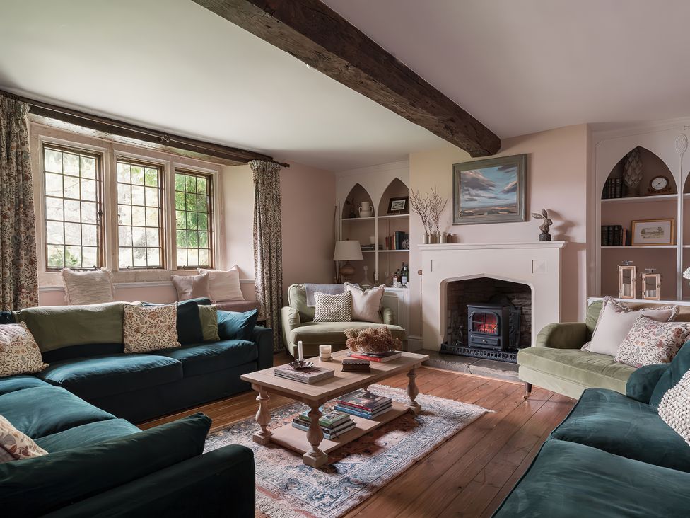 A living room with sofas and a coffee table at Reybridge House in Lacock