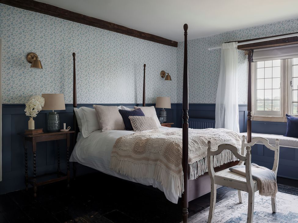 A bedroom with a bed and bedside table at Reybridge House in Lacock