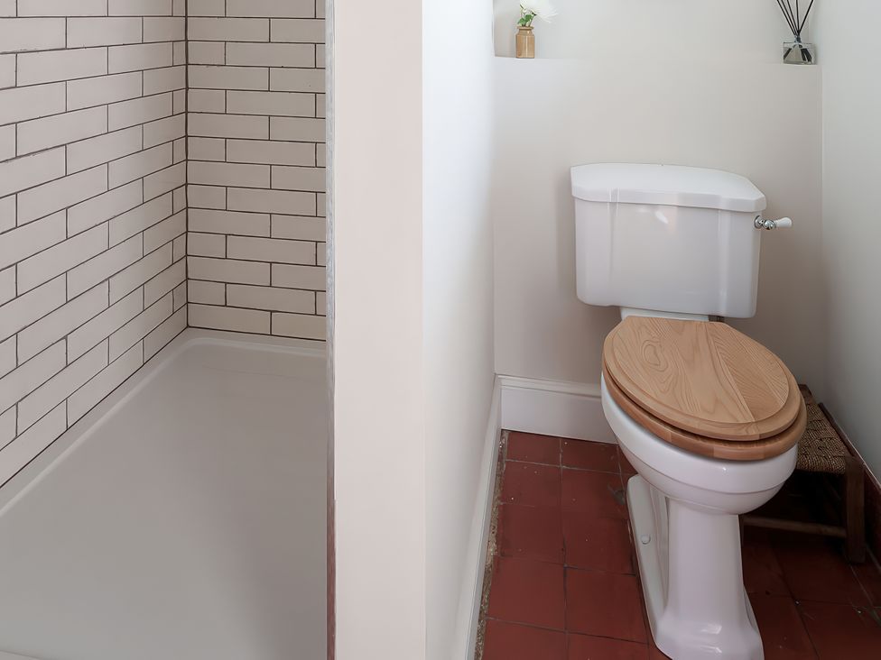 A bathroom with a shower and a toilet at Reybridge House in Lacock