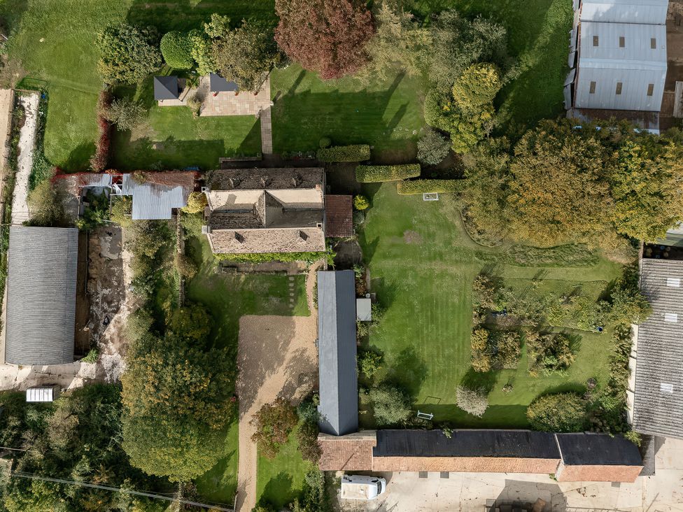 An outdoor area with garden and outbuildings at Reybridge House in Lacock