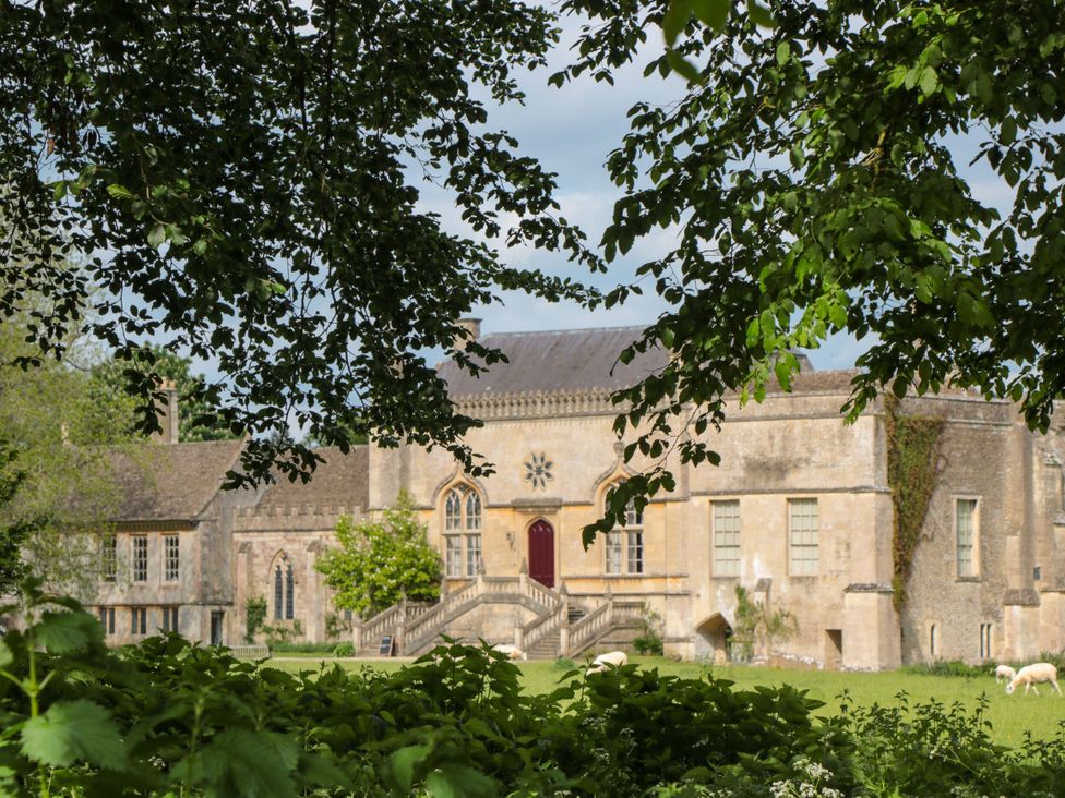 A building with stairs and windows outside Reybridge House in Lacock