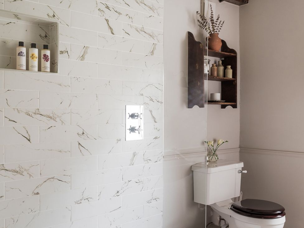 A bathroom with a shower and toilet at Reybridge House in Lacock