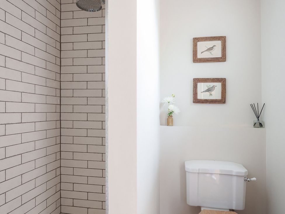 A bathroom with a shower and toilet at Reybridge House in Lacock