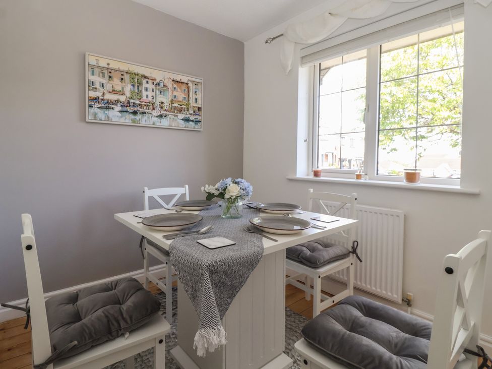 A dining room with a table and chairs at 5 Harebell Close Harrogate