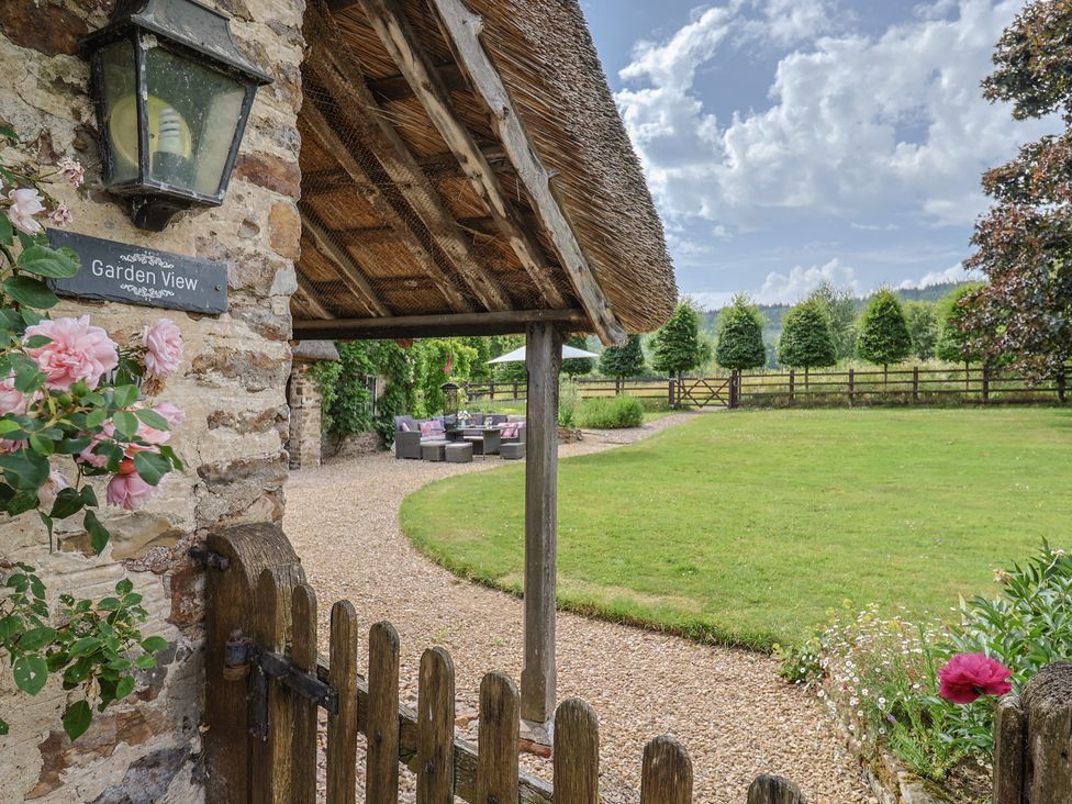 An outdoor area with a gate and seating at Garden View in Wellington