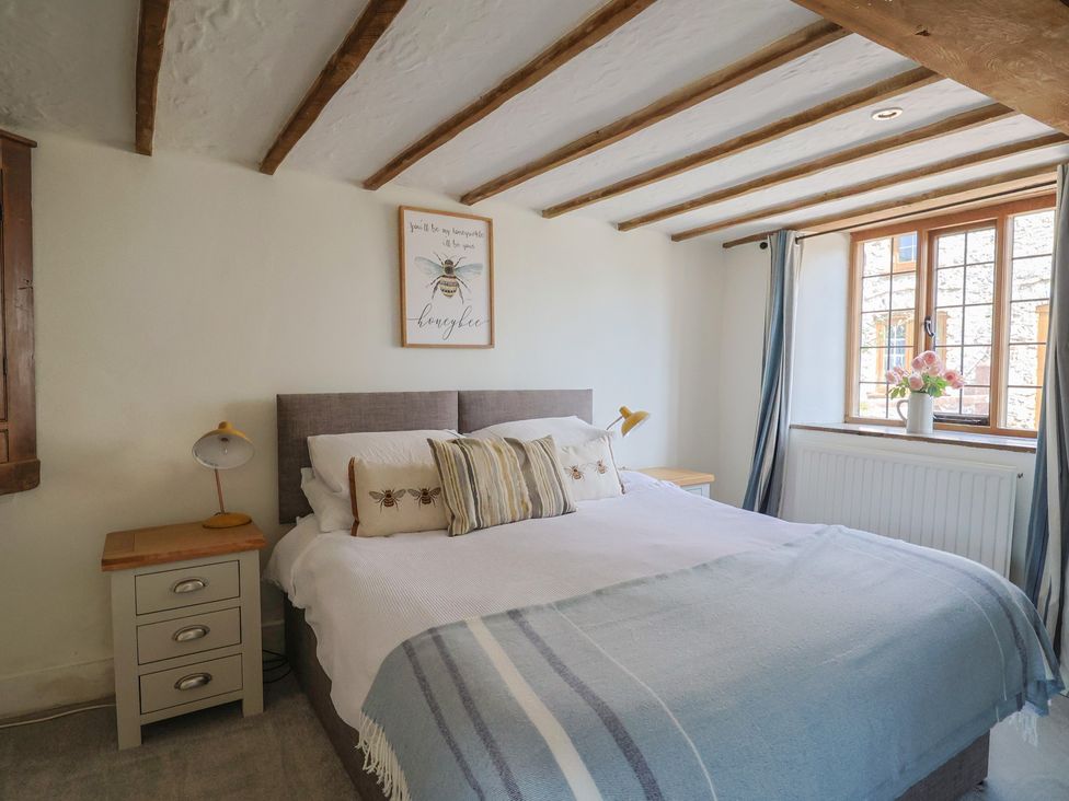 A bedroom with a bed and a window at Garden View in Wellington