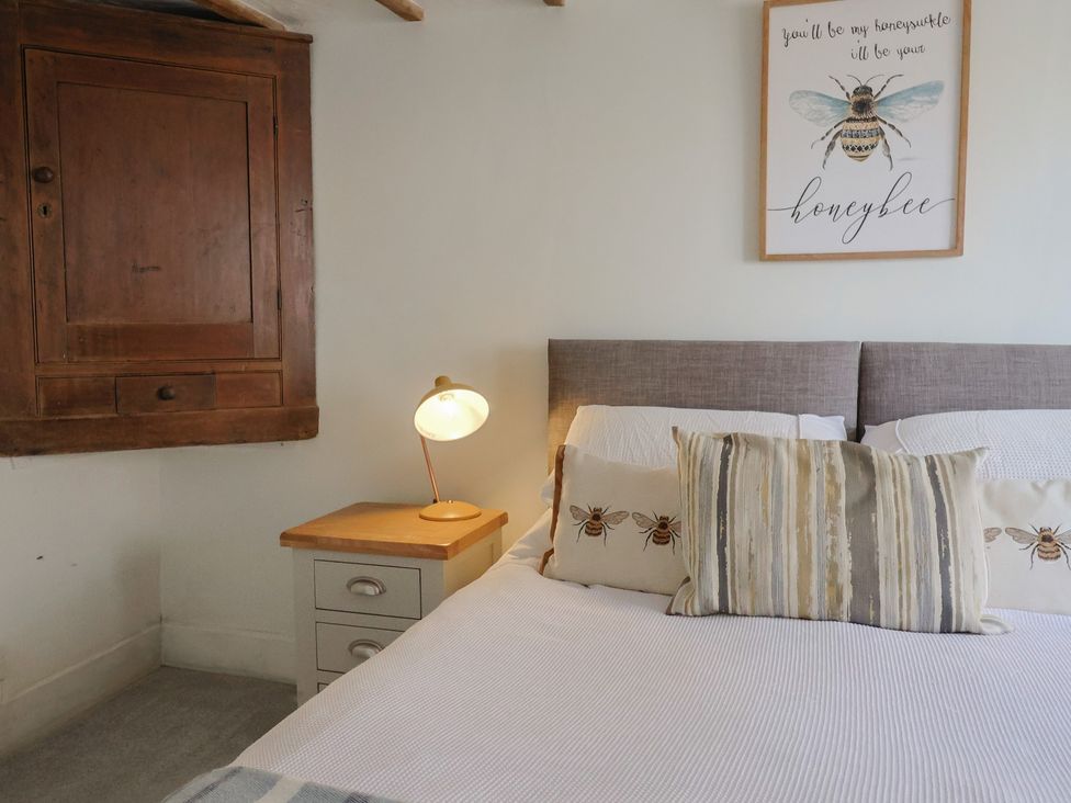A bedroom with a bed and lamp at Garden View in Wellington