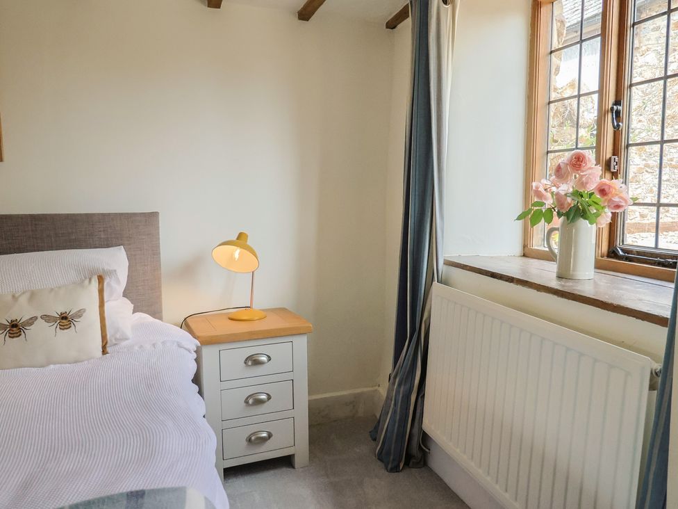 A bedroom with a bed and lamp at Garden View in Wellington