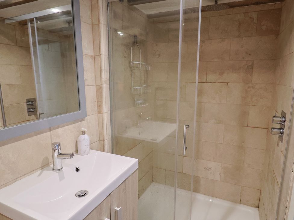 A bathroom with a shower and sink at Garden View in Wellington
