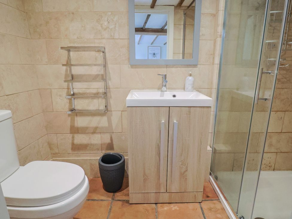 A bathroom with a sink, shower, and toilet at Garden View in Wellington