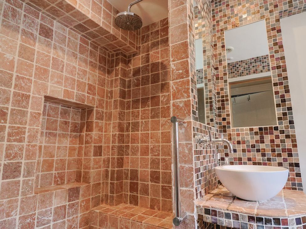 A bathroom with a shower and a sink at Garden View in Wellington