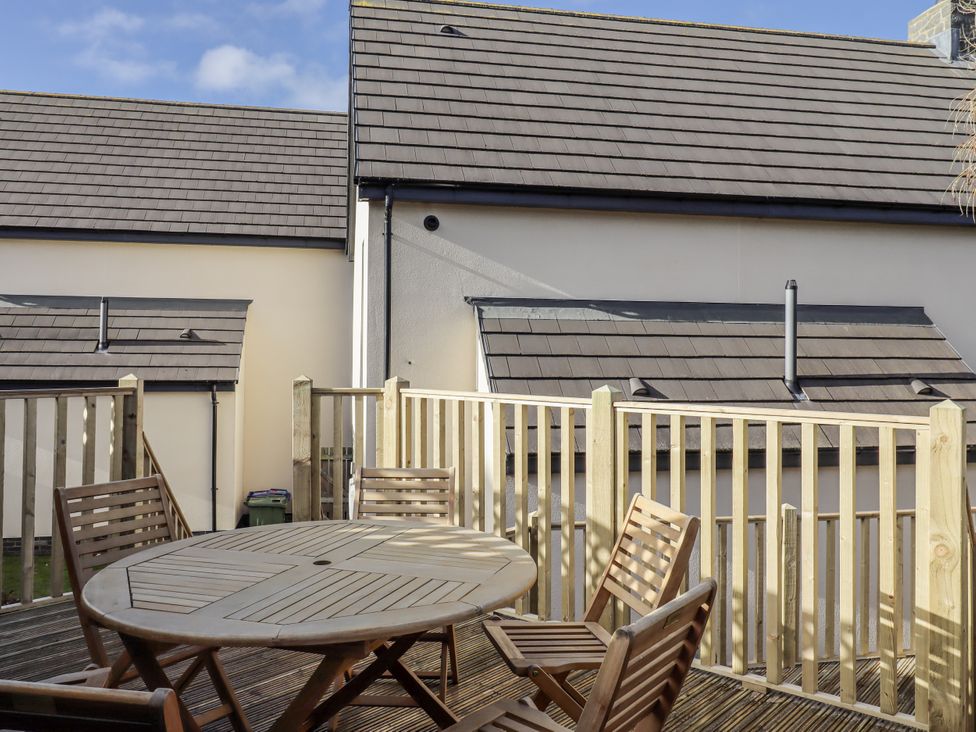 A table and chairs on a patio at Summer Rose in Craster