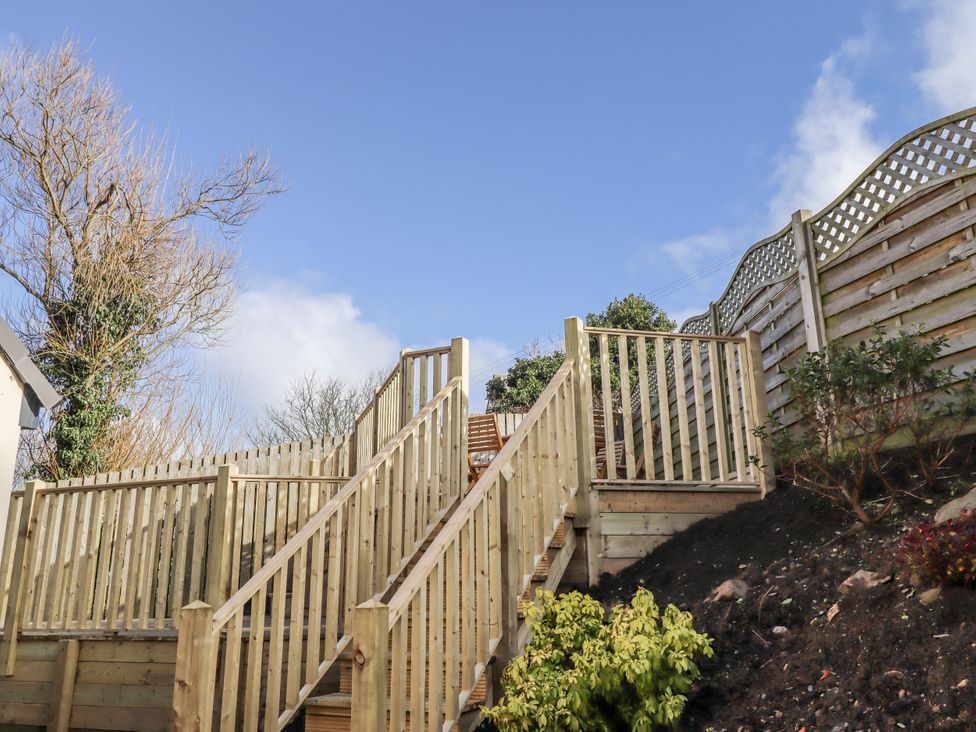 A staircase leading to a patio area at Summer Rose in Craster