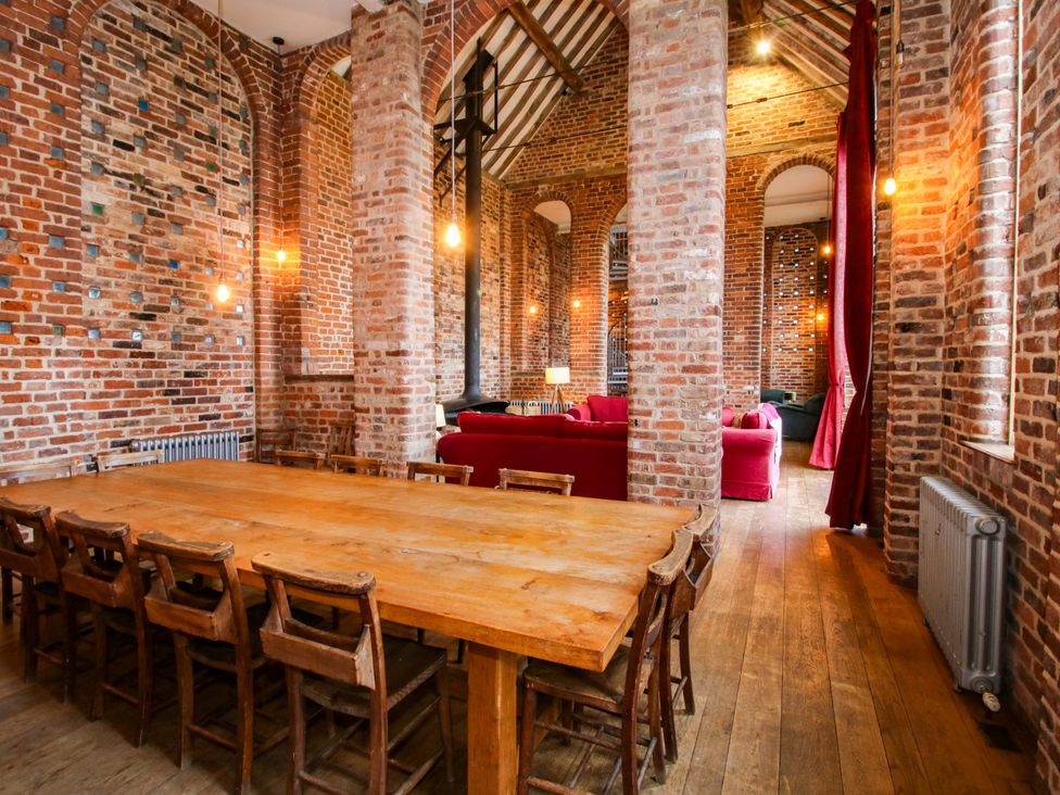 A dining room with a large table and chairs at Windy Mundy Farm in Pitchford near Shrewsbury
