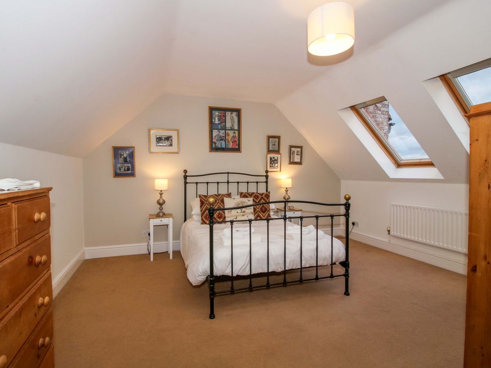 A bedroom with a bed and dresser at Windy Mundy Farm Pitchford near Shrewsbury