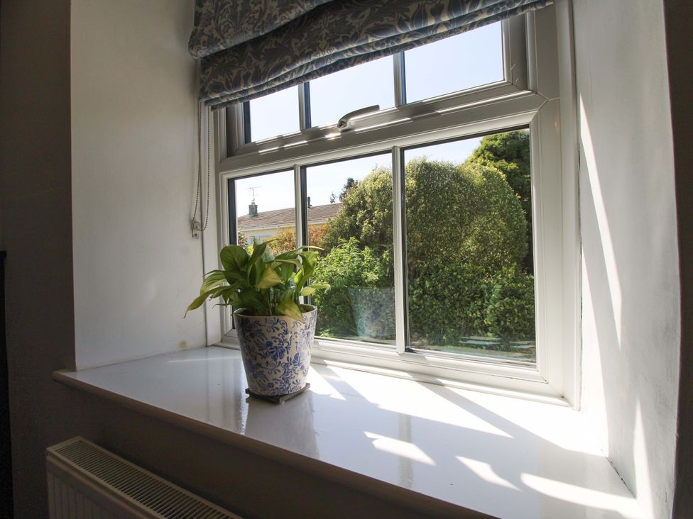 A window with a plant on the sill at 3 Rock Cottages in Kingston